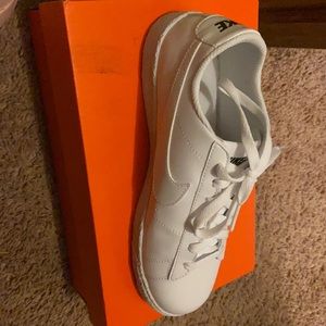 All white Nike shoes